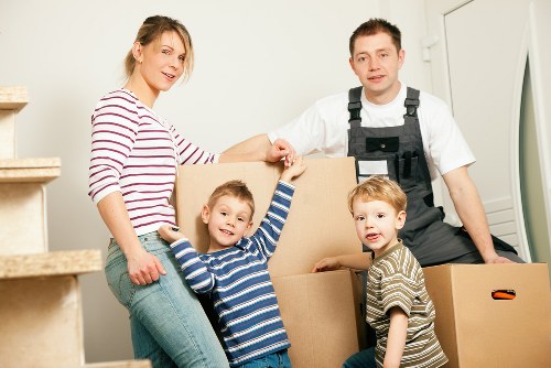 Professional Man With Van Merton loading items securely into a van