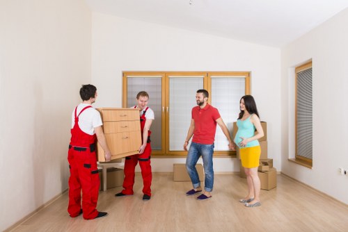 Packed boxes and furniture ready for house moving services in Merton