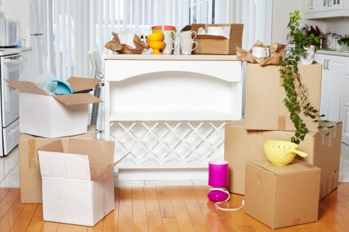 Packed boxes and household items ready for a Merton removal