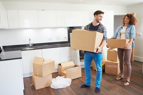 Furniture and boxes being loaded for a home removal in Merton