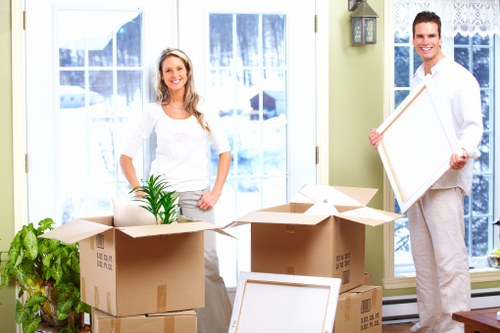 Commercial movers relocating office equipment in Merton