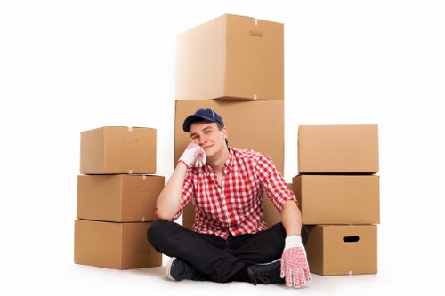 Removal team loading household furniture for a move in Merton