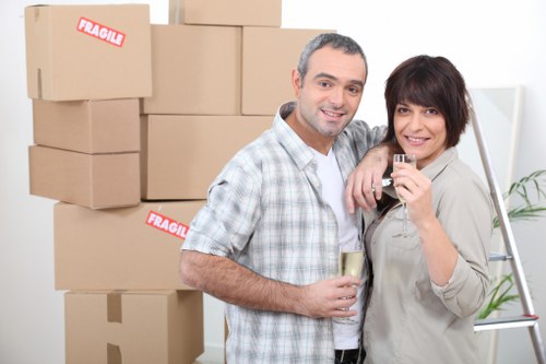 Careful packing of fragile household items for a Merton relocation